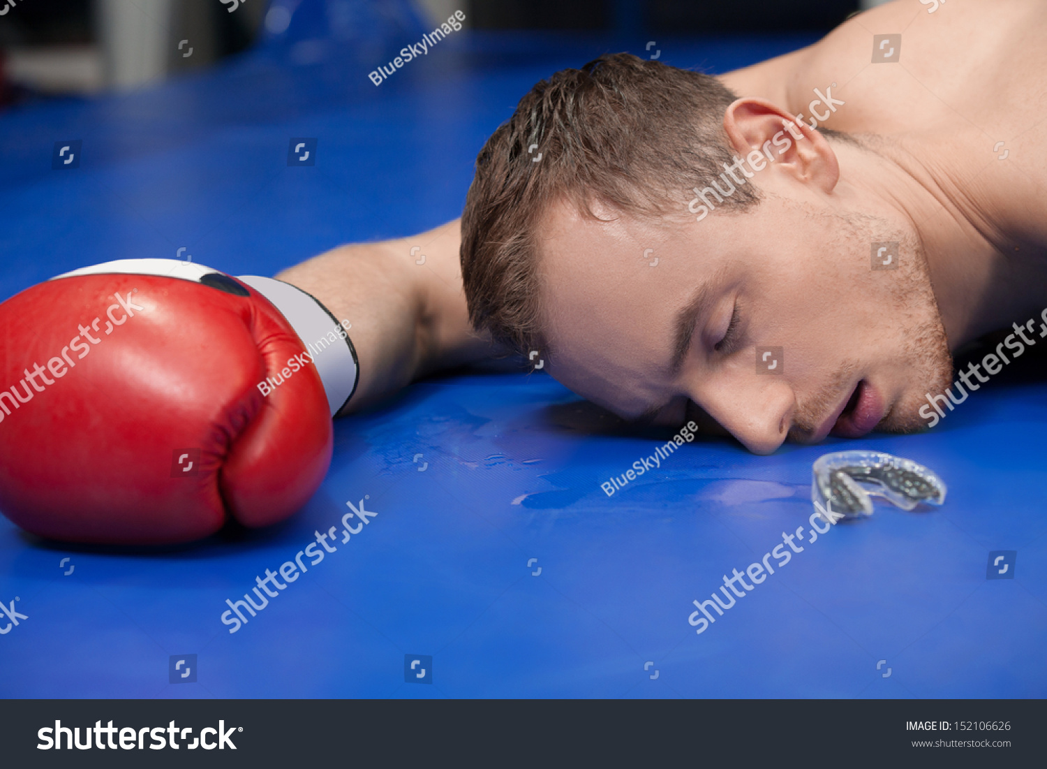 stock-photo-defeated-boxer-close-up-of-defeated-boxer-lying-down-on-the-boxing-ring-with-close...jpg